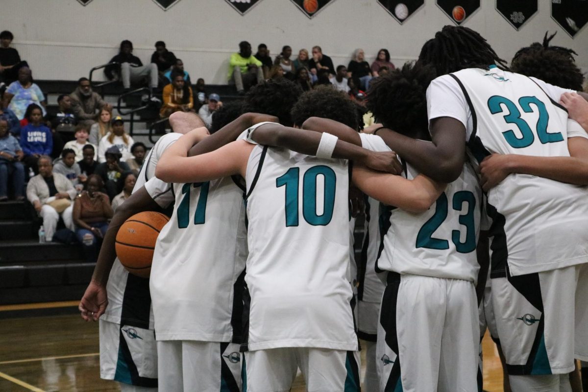 Rivalry Night Belongs to Olympia: Titan Boys Basketball Team Makes History on the Court